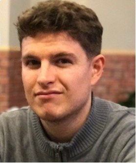 headshot of a man with dark hair