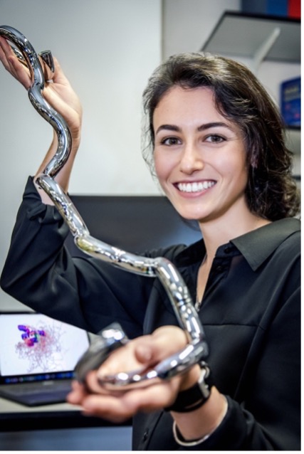 a female researcher smiling at the camera