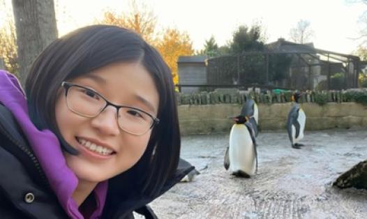 Picture of student and penguin